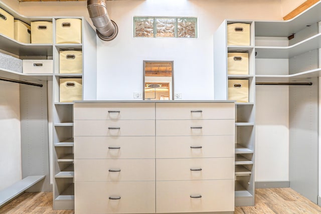 78 Quirks Ln, Corrales, NM 87048 - walk in closet with light wood finished floors