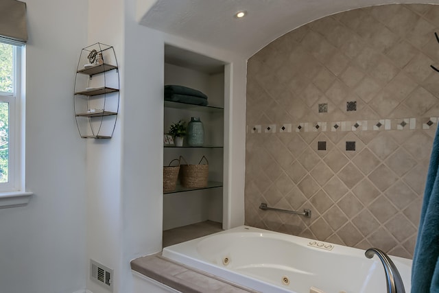 6109 Chamblee Ct NE, Albuquerque, NM 87111 - bathroom with a jetted tub and built in shelves