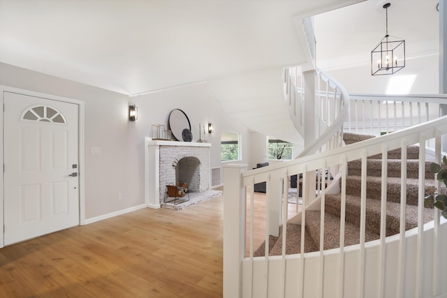 7 Corte De Canoncito, Cedar Crest, NM 87008 - entrance foyer featuring hardwood / wood-style flooring, stairway, and a chandelier