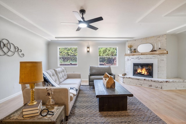 7 Corte De Canoncito, Cedar Crest, NM 87008 - living room with a brick fireplace, wood finished floors, and a ceiling fan