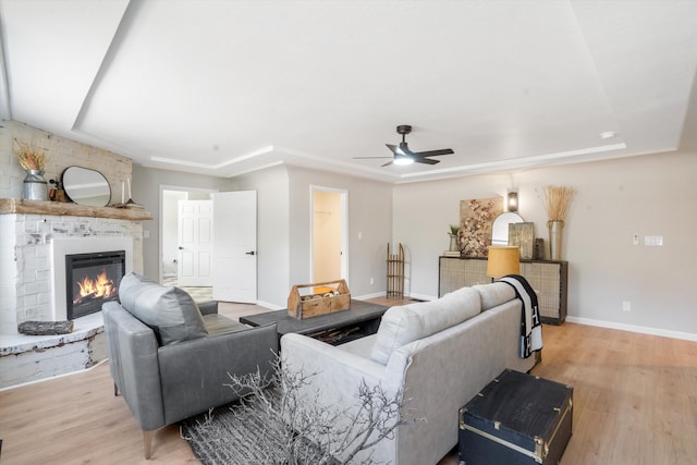 7 Corte De Canoncito, Cedar Crest, NM 87008 - living room featuring a ceiling fan, a fireplace, and wood finished floors