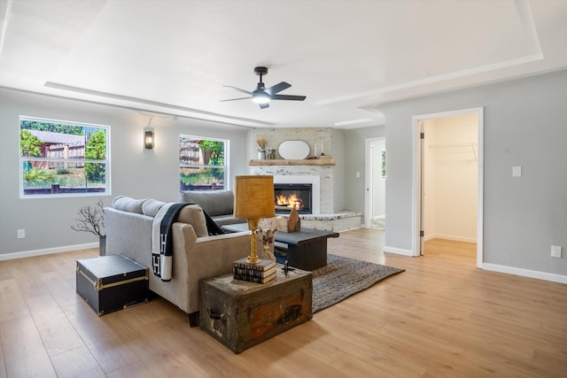 7 Corte De Canoncito, Cedar Crest, NM 87008 - living area with ceiling fan, light wood-style floors, and a fireplace