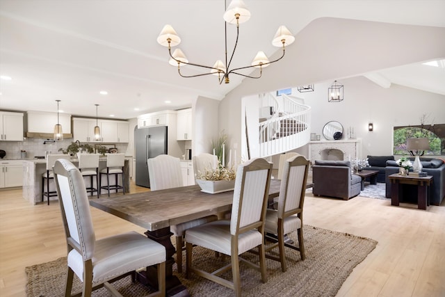 7 Corte De Canoncito, Cedar Crest, NM 87008 - dining area with a chandelier, lofted ceiling, light wood-style flooring, and recessed lighting