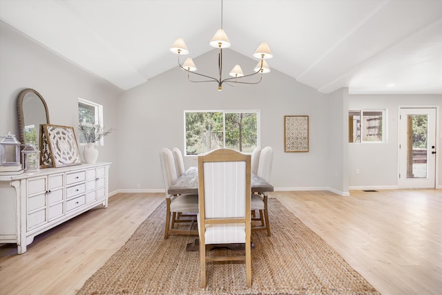 7 Corte De Canoncito, Cedar Crest, NM 87008 - dining area with healthy amount of natural light, a chandelier, light wood-type flooring, and lofted ceiling