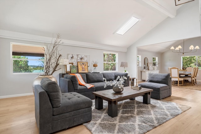 7 Corte De Canoncito, Cedar Crest, NM 87008 - living room featuring beamed ceiling, a chandelier, light wood-type flooring, and high vaulted ceiling