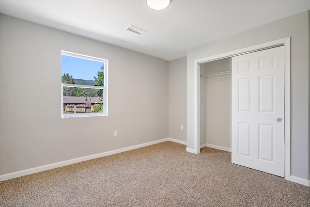 7 Corte De Canoncito, Cedar Crest, NM 87008 - unfurnished bedroom featuring carpet flooring and a closet