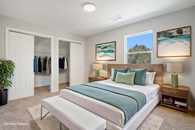 7 Corte De Canoncito, Cedar Crest, NM 87008 - bedroom with multiple closets and carpet