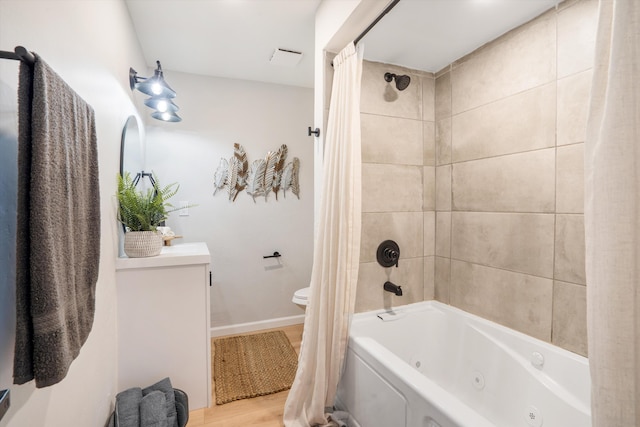 7 Corte De Canoncito, Cedar Crest, NM 87008 - bathroom with a combined bath / shower with jetted tub, wood finished floors, and vanity