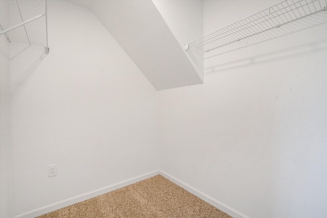 7 Corte De Canoncito, Cedar Crest, NM 87008 - spacious closet with carpet flooring and vaulted ceiling