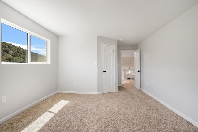 7 Corte De Canoncito, Cedar Crest, NM 87008 - unfurnished bedroom with light carpet