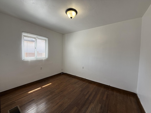 98 Rancho Pequenos Way, Albuquerque, NM 87114 - empty room with dark wood-type flooring
