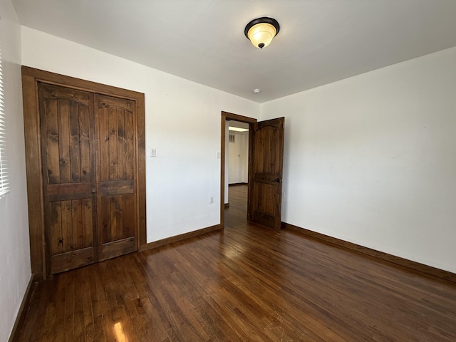 98 Rancho Pequenos Way, Albuquerque, NM 87114 - unfurnished bedroom featuring dark wood-type flooring and baseboards