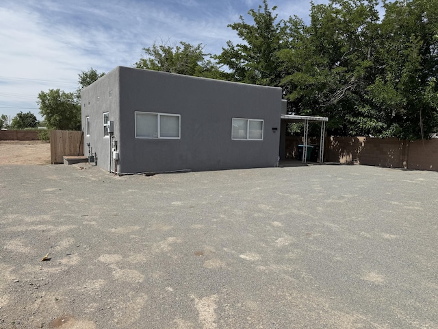 98 Rancho Pequenos Way, Albuquerque, NM 87114 - back of house with stucco siding