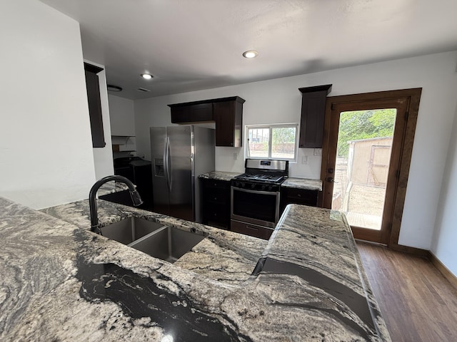 98 Rancho Pequenos Way, Albuquerque, NM 87114 - kitchen with stainless steel appliances, wood finished floors, light stone countertops, and recessed lighting