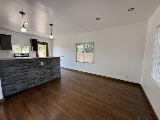 98 Rancho Pequenos Way, Albuquerque, NM 87114 - unfurnished living room featuring dark wood-style flooring and recessed lighting