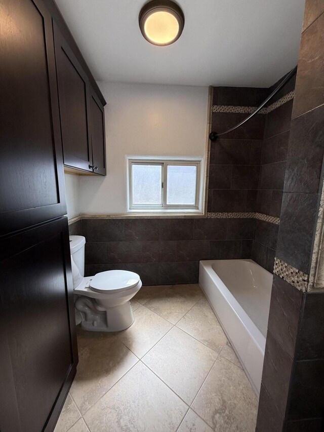 98 Rancho Pequenos Way, Albuquerque, NM 87114 - full bath featuring tile walls, tile patterned flooring, bathtub / shower combination, and wainscoting