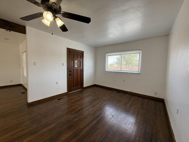 98 Rancho Pequenos Way, Albuquerque, NM 87114 - spare room with dark wood finished floors and a ceiling fan