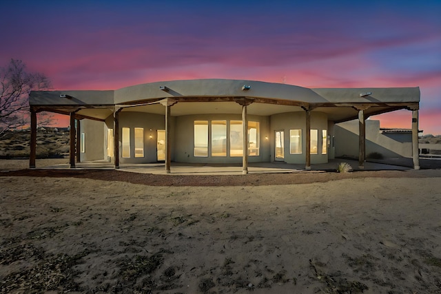 3 Quiet Ln, Corrales, NM 87048 - rear view of property with stucco siding and a patio