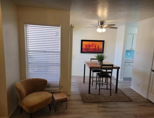 4601 Carlisle Blvd NE Unit H-2, Albuquerque, NM 87109 - dining area featuring a ceiling fan and wood finished floors