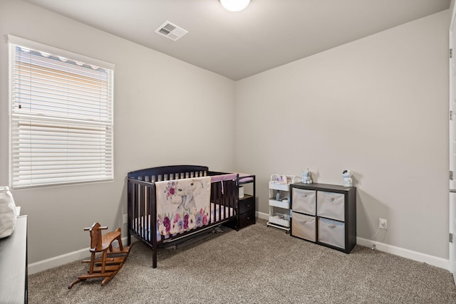 6873 Cleary Loop NE, Rio Rancho, NM 87144 - carpeted bedroom featuring baseboards and a crib