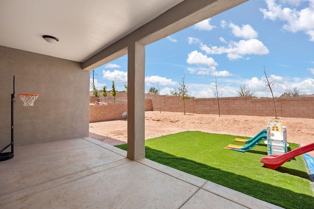 6873 Cleary Loop NE, Rio Rancho, NM 87144 - fenced backyard featuring a playground and a patio area