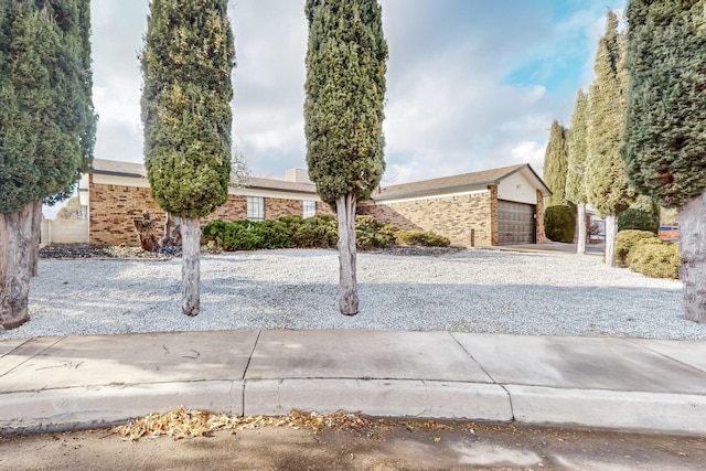 4807 Parsifal St NE, Albuquerque, NM 87111 - view of front of house featuring brick siding and an attached garage