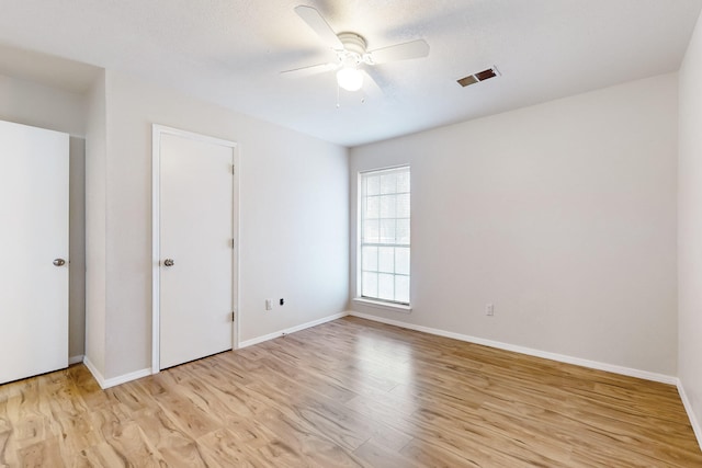 4807 Parsifal St NE, Albuquerque, NM 87111 - unfurnished bedroom featuring light wood-type flooring and a ceiling fan
