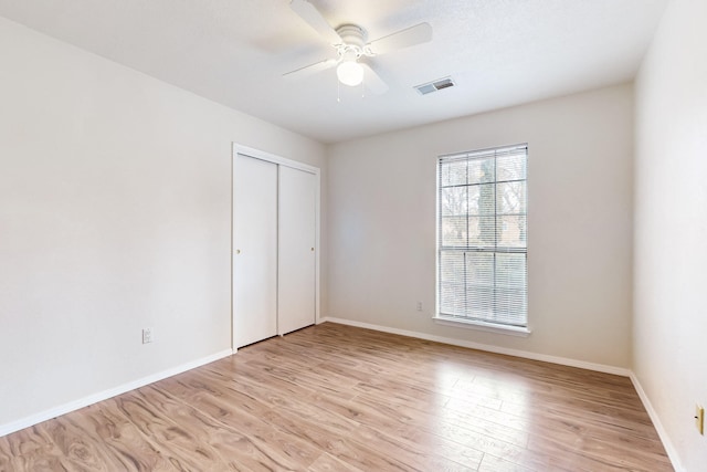 4807 Parsifal St NE, Albuquerque, NM 87111 - unfurnished bedroom featuring light wood-style floors, a closet, and ceiling fan