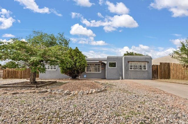 5501 Arvilla Ave NE, Albuquerque, NM 87110 - adobe home featuring stucco siding