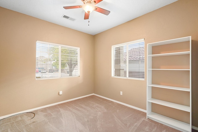 5443 Reserve Ct NE, Rio Rancho, NM 87144 - empty room with a ceiling fan and carpet flooring