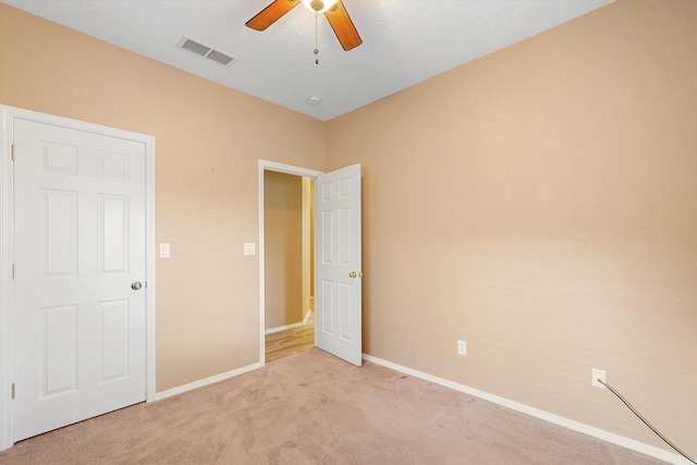 5443 Reserve Ct NE, Rio Rancho, NM 87144 - unfurnished bedroom with light colored carpet and a ceiling fan