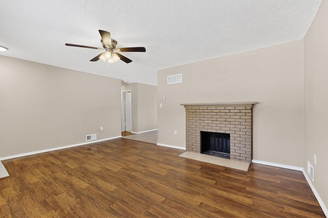 6312 Zimmerman Ave NE, Albuquerque, NM 87110 - unfurnished living room featuring ceiling fan, wood finished floors, and a fireplace