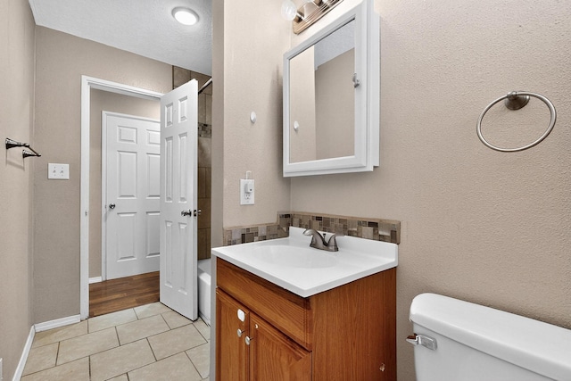 6312 Zimmerman Ave NE, Albuquerque, NM 87110 - bathroom featuring vanity, tile patterned flooring, and backsplash