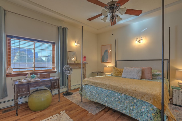 400 Paseo Del Bosque NW, Albuquerque, NM 87114 - bedroom with baseboard heating and wood finished floors