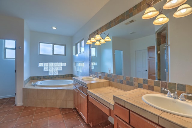 9404 Bear Mountain Trl NE, Albuquerque, NM 87113 - bathroom featuring double vanity, a garden tub, and tile patterned floors