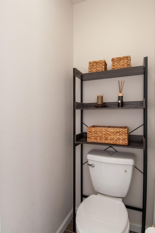 6820 Los Trechos Ct NE, Albuquerque, NM 87109 - bathroom featuring baseboards and toilet