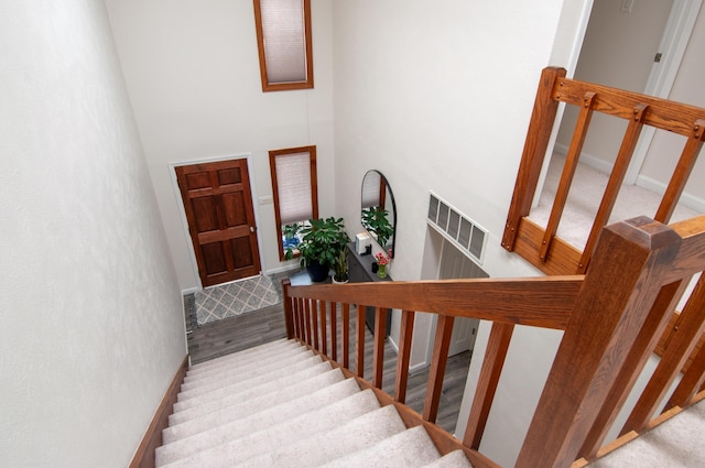 6820 Los Trechos Ct NE, Albuquerque, NM 87109 - staircase with a high ceiling and baseboards