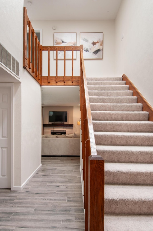 6820 Los Trechos Ct NE, Albuquerque, NM 87109 - staircase with wood finished floors and baseboards