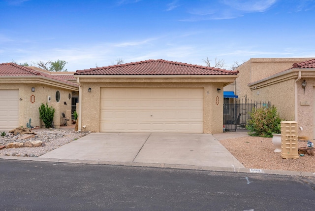 596 Eastlake Dr SE, Rio Rancho, NM 87124 - mediterranean / spanish home featuring stucco siding, a tile roof, and driveway