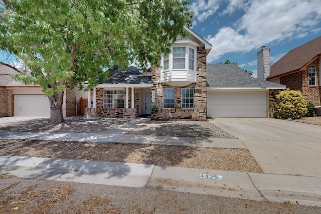 4429 Cattleya Rd NW, Albuquerque, NM 87120 - traditional-style house with a garage, concrete driveway, and brick siding