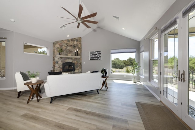 42 Los Pecos Loop, Tijeras, NM 87059 - living area with ceiling fan, a fireplace, light wood finished floors, and high vaulted ceiling