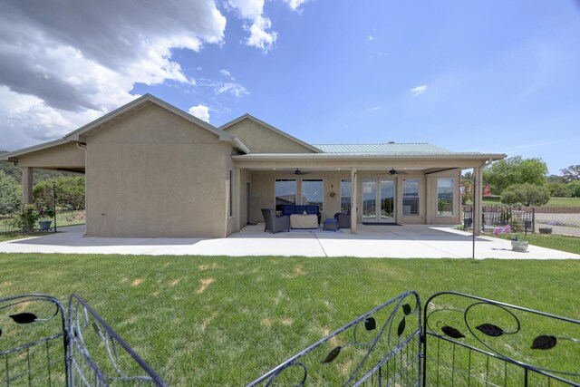 42 Los Pecos Loop, Tijeras, NM 87059 - back of property with a ceiling fan, an outdoor hangout area, a patio, and french doors