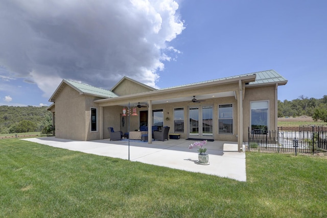 42 Los Pecos Loop, Tijeras, NM 87059 - rear view of property with a ceiling fan, a patio, stucco siding, a metal roof, and a standing seam roof