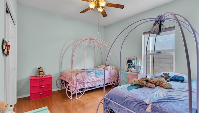 3915 Tundra Swan Ct NW, Albuquerque, NM 87120 - bedroom featuring wood finished floors, a ceiling fan, and a closet
