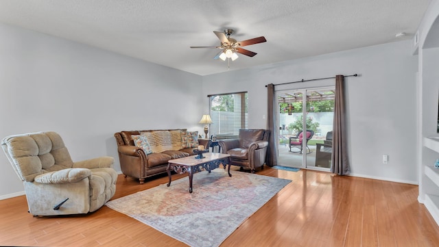 3915 Tundra Swan Ct NW, Albuquerque, NM 87120 - living area with a ceiling fan, light wood-style flooring, and a textured ceiling