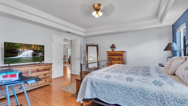 3915 Tundra Swan Ct NW, Albuquerque, NM 87120 - bedroom with wood finished floors, a raised ceiling, and ceiling fan