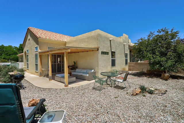 640 Renaissance Loop SE, Rio Rancho, NM 87124 - rear view of property featuring stucco siding and a patio area
