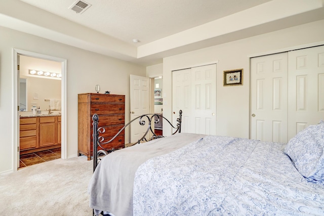 640 Renaissance Loop SE, Rio Rancho, NM 87124 - bedroom featuring multiple closets, carpet, and ensuite bath