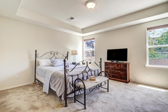 640 Renaissance Loop SE, Rio Rancho, NM 87124 - carpeted bedroom featuring multiple windows and a textured ceiling