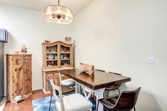 640 Renaissance Loop SE, Rio Rancho, NM 87124 - dining area featuring a chandelier and wood finished floors